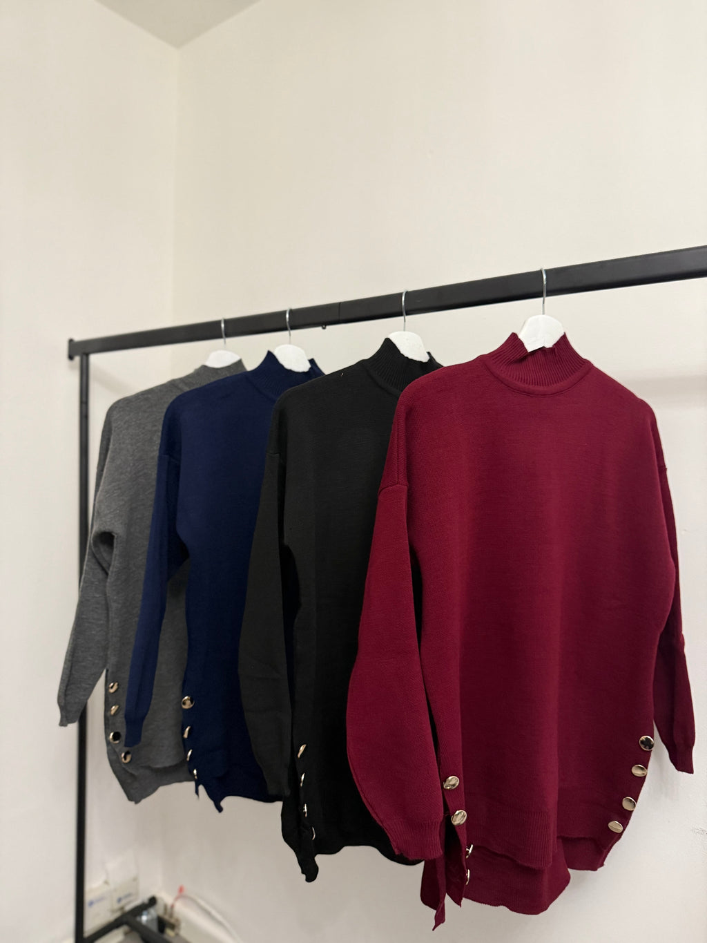 High-Neck Oversized Knit Top – Button Detail & High-Low Hem