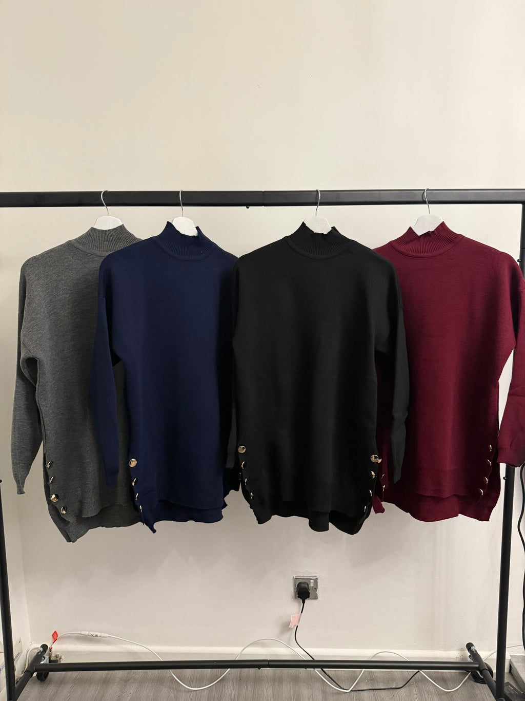 High-Neck Oversized Knit Top – Button Detail & High-Low Hem